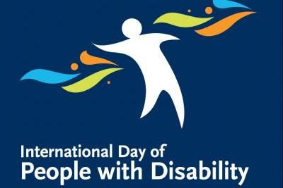 International day of people with disability logo, human figure with coloured filigrees and text
